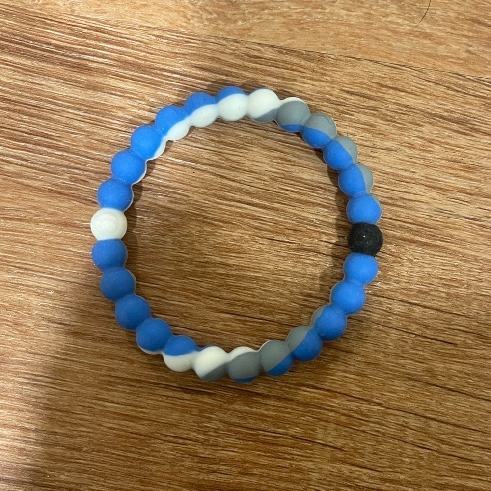 Blue, grey, and white Lokai bracelet​​​​​​​​